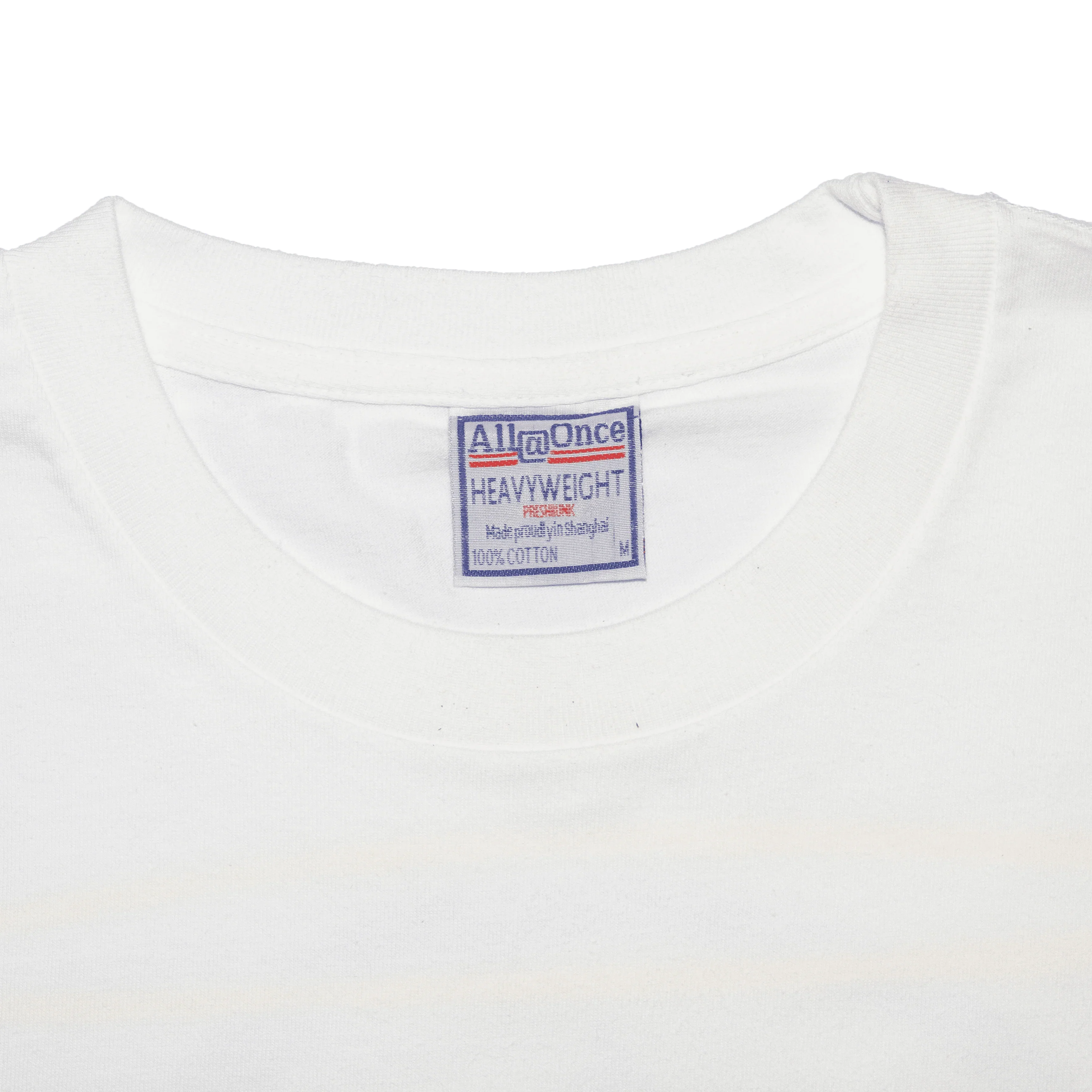Close-up of a white heavyweight cotton t-shirt collar and neck label