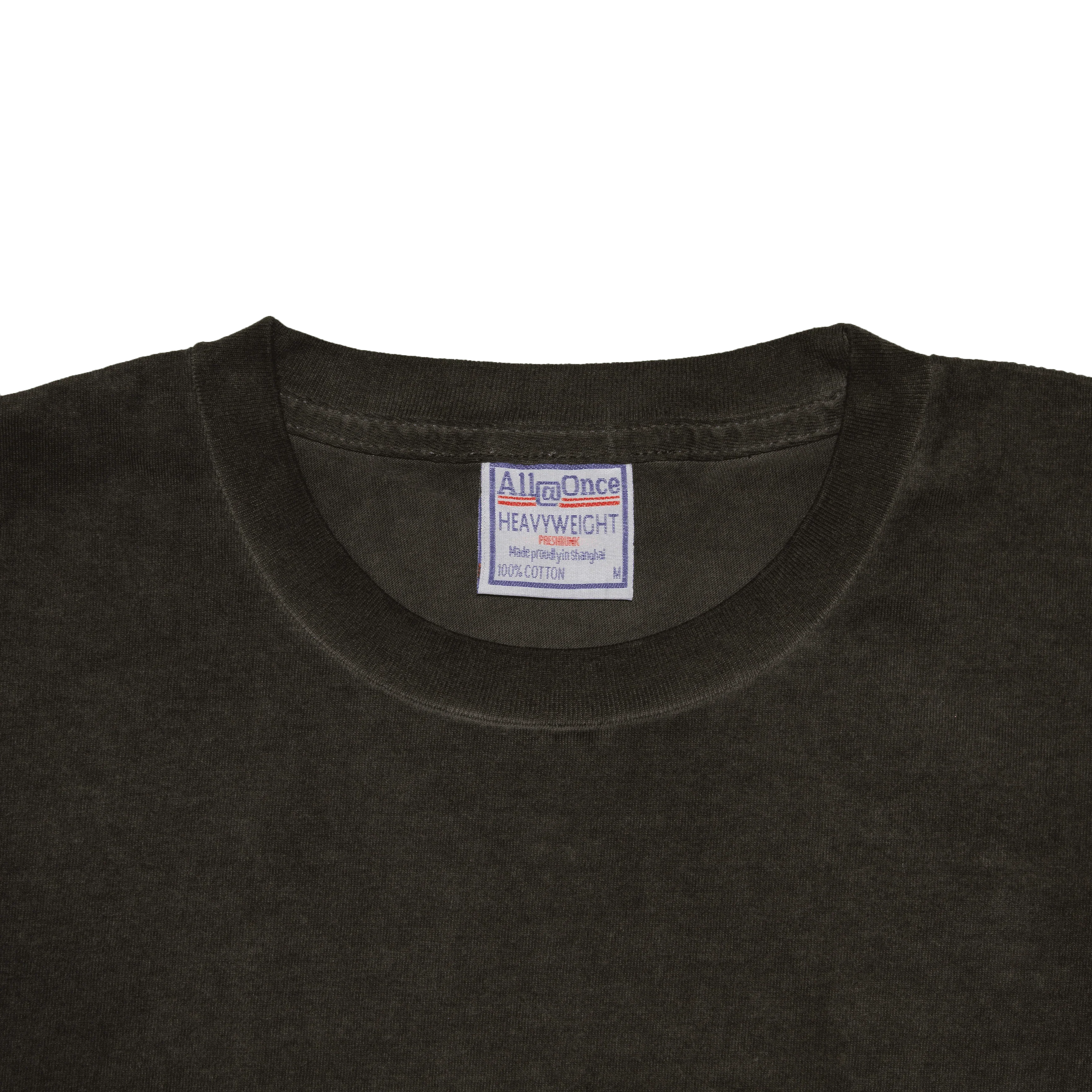 Black heavyweight cotton t-shirt close up with visible label and crew neckline