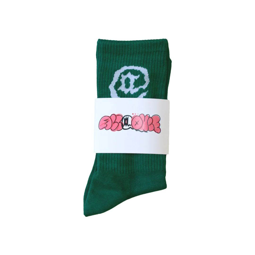Green crew sock with cartoon pea face design and unique illustrated label packaging