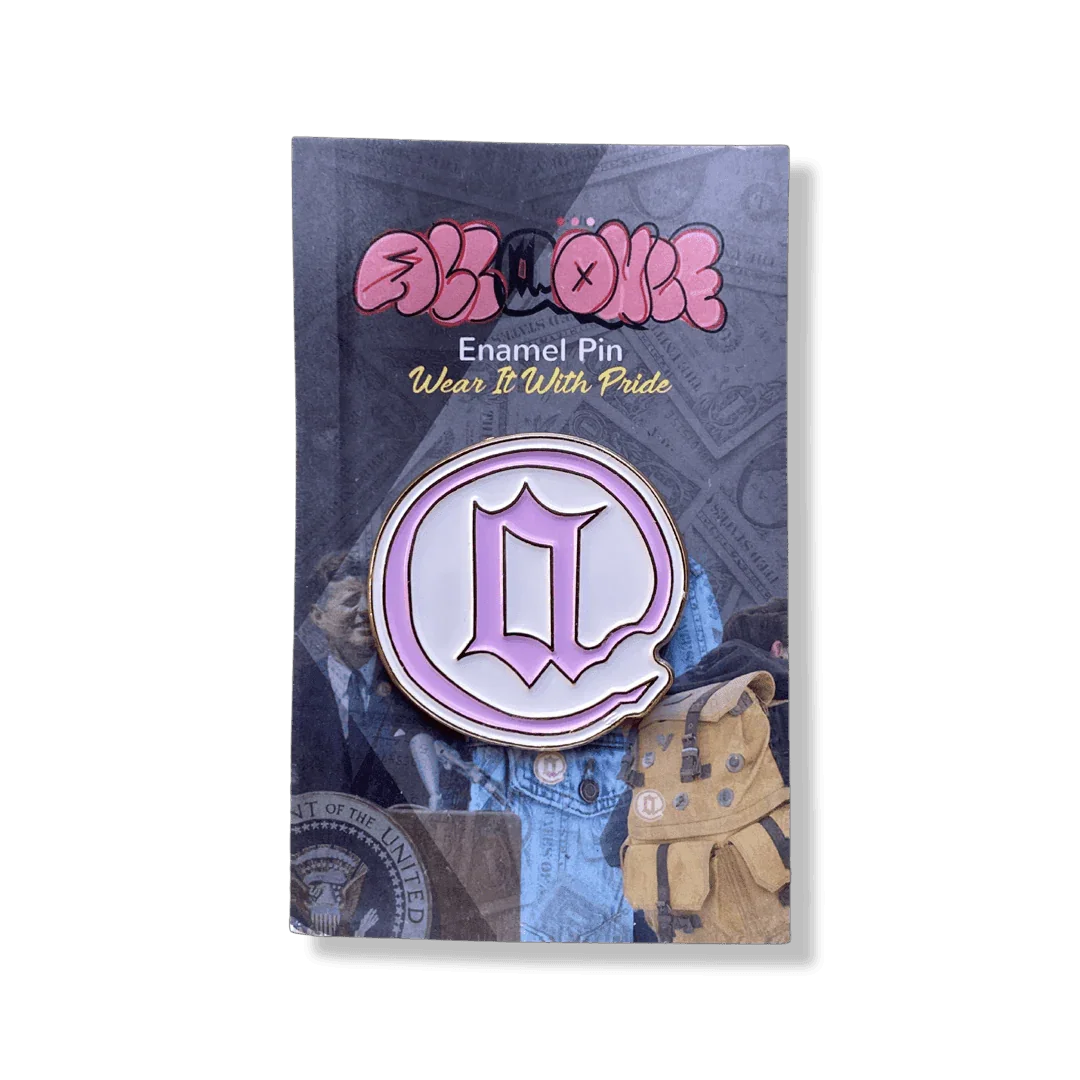 Pink enamel pin with stylized letter Q on display card, accessory, collectible badge