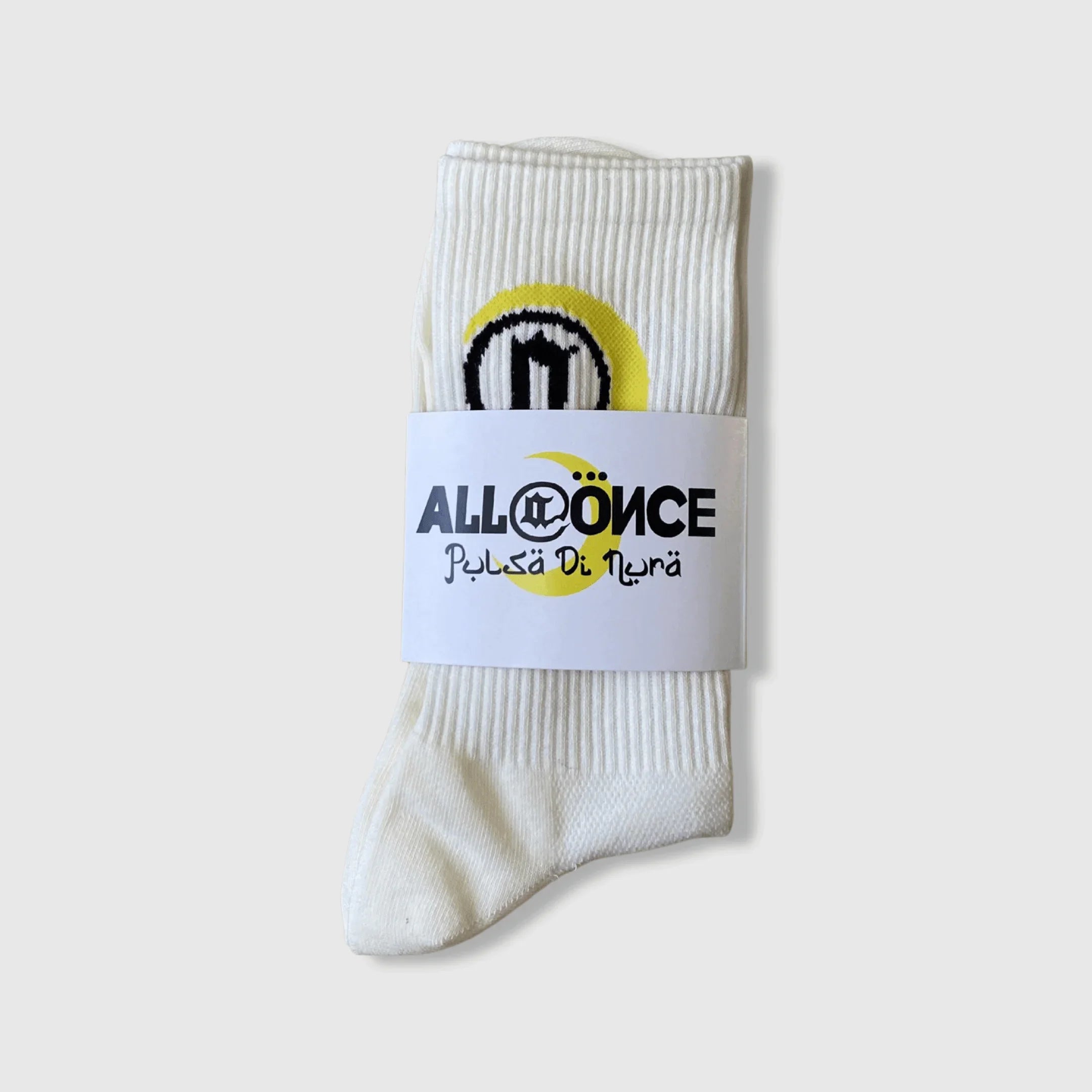 White ribbed socks with black and yellow logo and 'ALLONCE Pulsa Di Nura' label on packaging